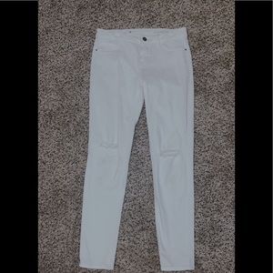 White jeans with ripped knees